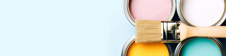 Banner of renovation concept. Brush with wooden handle on opened cans on blue pastel background. Yellow, white, pink, turquoise colors. Macro.